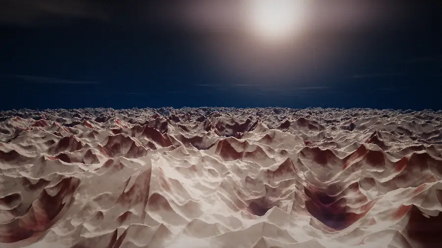 White and red mountain terrain stretching to the horizon under a low sun